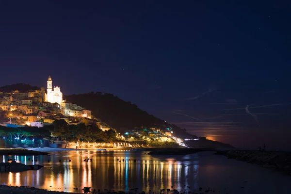 Starry sky and moonlight at glowing Cervo, Ligurian Riviera, Italy — Stock Photo, Image