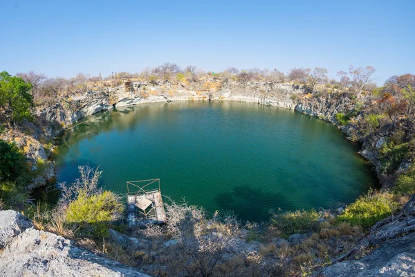 Otjikoto Lake, one of the only two permanent natural lake in Namibia, famous travel destination in Africa. Ultra wide view. — Stock Photo, Image