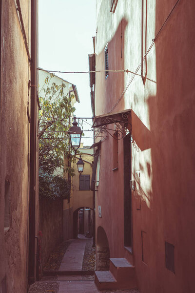 Narrow alleys, historical old ancient town in Italy, architectural details, toned image, vintage filter, split toning.