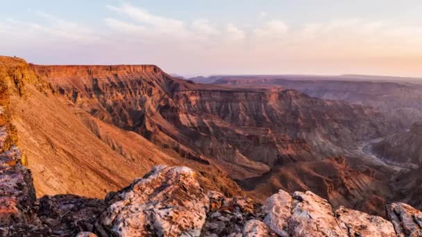Panorama from above on the Fish River Canyon, scenic travel destination in Southern Namibia. Last sunlight on the mountain ridges. — Stock Video