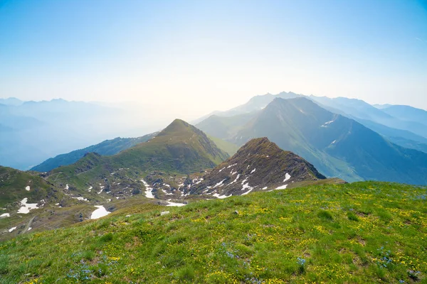 High altitude landscape idyllic uncontaminated environment. Summer adventures and exploration on the Alps. Expansive view from above, clear blue sky., backlight — Stock Photo, Image