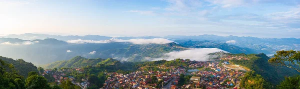 Aerial view of Phongsali, North Laos near China. Yunnan style town on scenic mountain ridge. Travel destination for tribal trekking in Akha villages. Fog and mist in the valley. — Stock Photo, Image