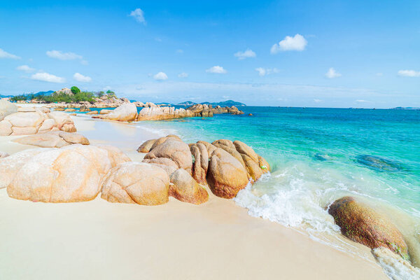 Gorgeous tropical beach turquoise transparent water unique rock boulders, Cam Ranh Nha Trang Vietnam south east coast travel destination, desert beach no people clear blue sky