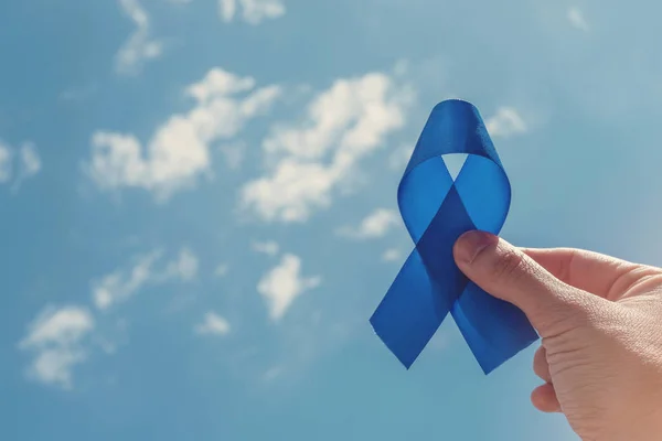 Hand Holding Blue Ribbon Blue Sky Background — Stock Photo, Image