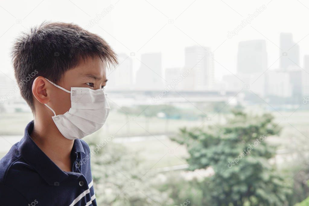 Young Asian preteen boy wearing medical face mask,  Wuhan corona