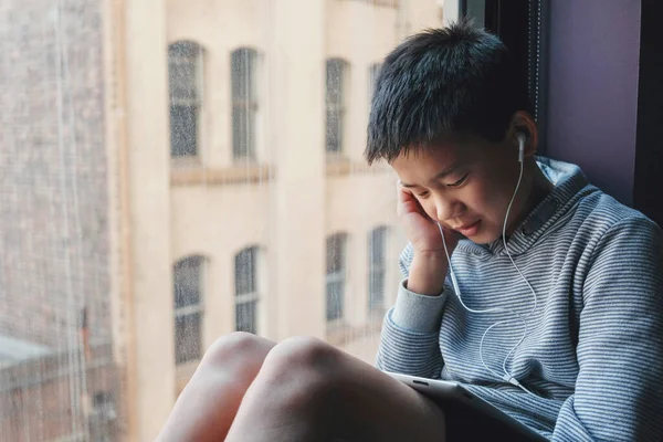 Young Mixed Asian Preteen Boy Using Digital Tablet Home Listening — Stock Photo, Image