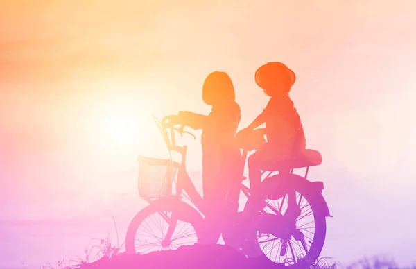 silhouette of a happy children and happy time sunset