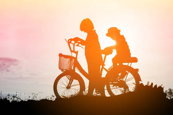 silhouette of a happy children and happy time sunset