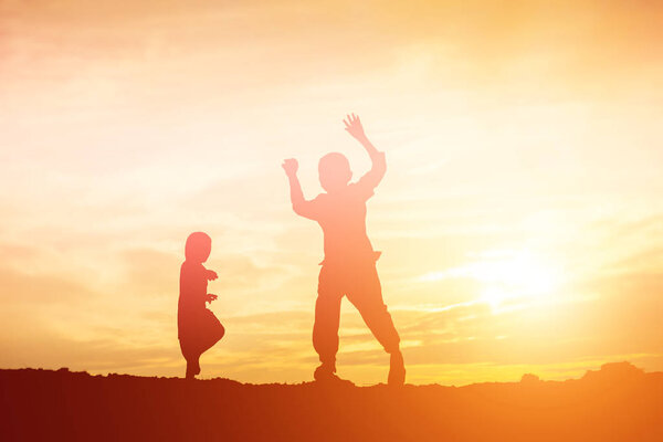 kid silhouette,Moments of the child's joy. On the Nature sunset