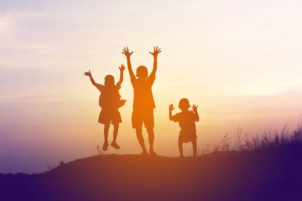 two little boys bike silhouette