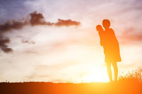 Mother Holding Baby Walking Sunset Background — Stock Photo, Image