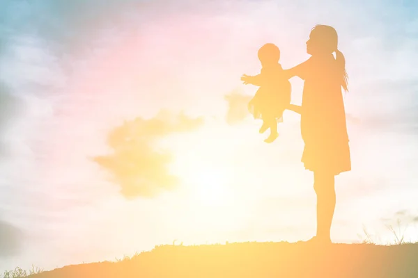 Mother Holding Baby Walking Sunset Background — Stock Photo, Image