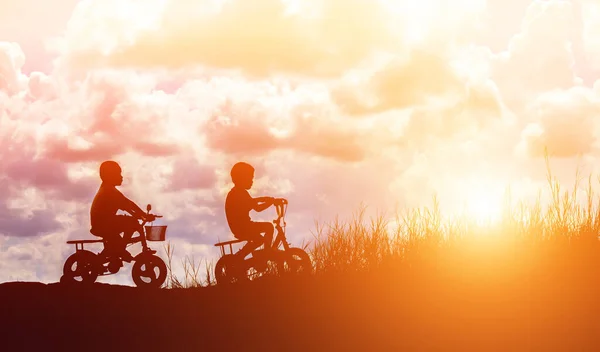 Two Little Boys Bike Silhouette — Stock Photo, Image