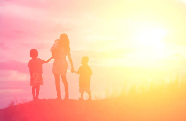 Mother Holding Baby Walking Sunset Background — Stock Photo, Image
