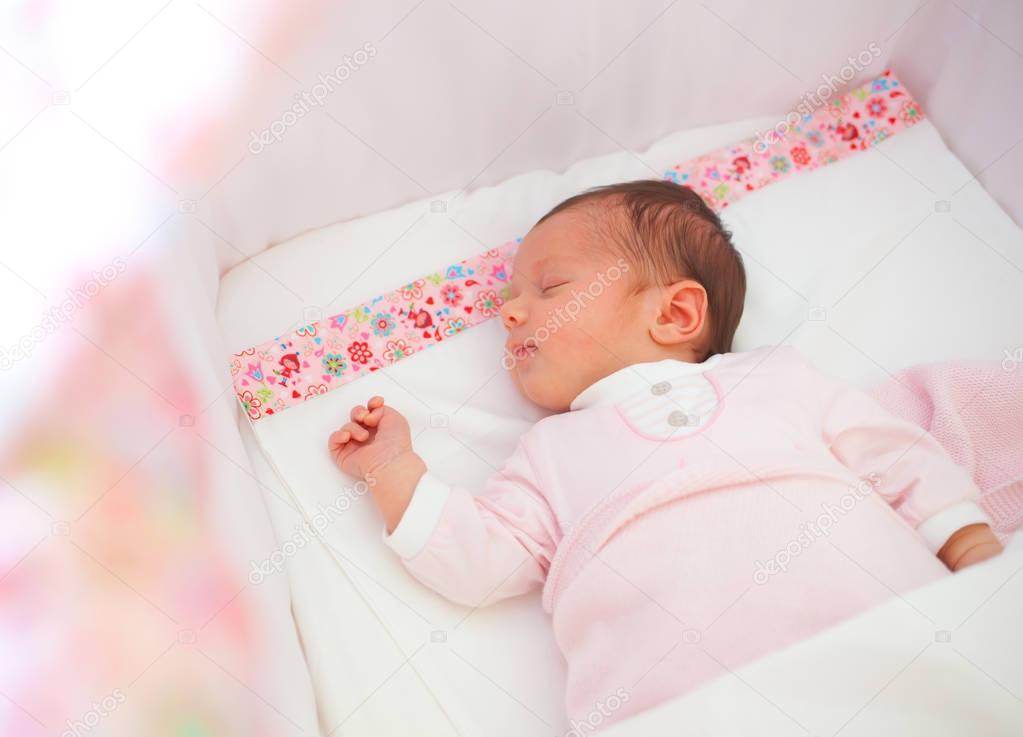 Portrait of sleeping newborn baby girl