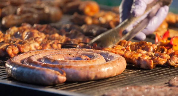 Grilled meat on a hot grill. — Stock Photo, Image