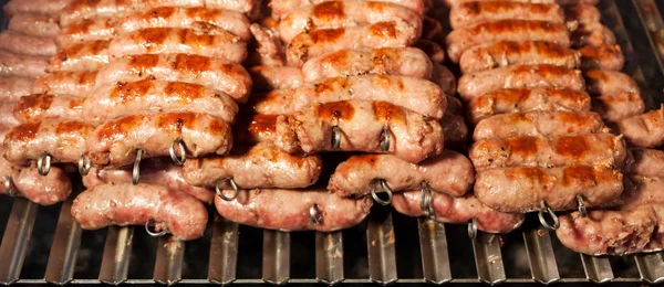 Grilled meat on a hot grill. — Stock Photo, Image