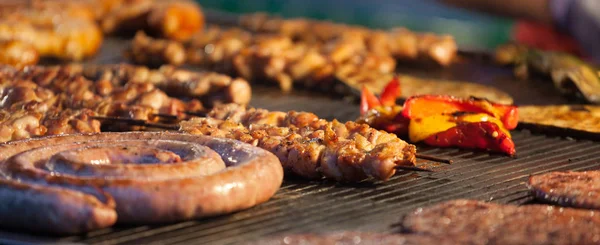Grilled meat on a hot grill. — Stock Photo, Image