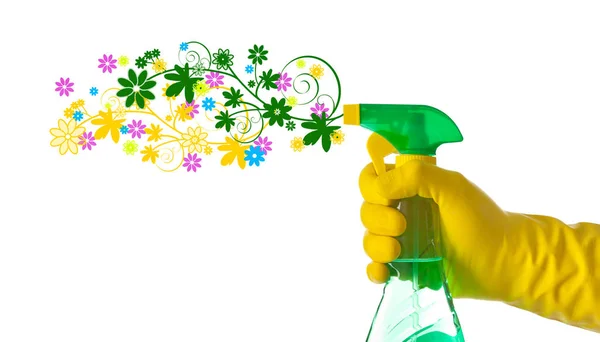 Concepto de limpieza de primavera. Detergente floral rociado por una mano con — Foto de Stock