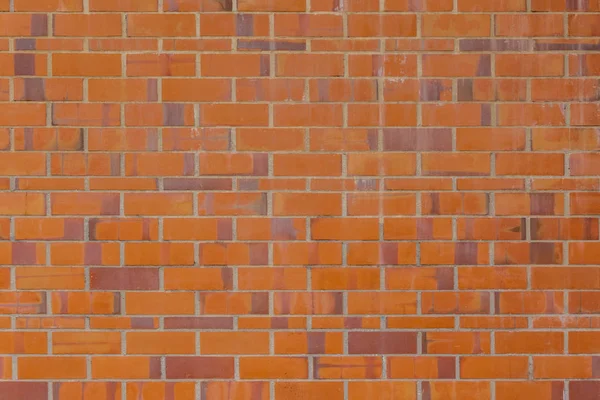 Tło starzejącego się muru z cegły pomarańczowej i czerwonej. Tło cegły — Zdjęcie stockowe