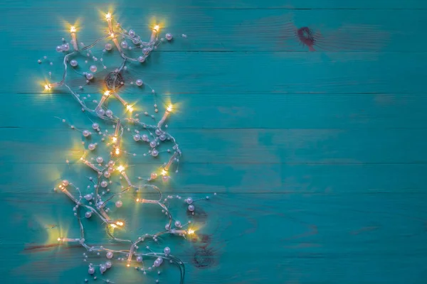 Christmas rustic background with lights and free space for text