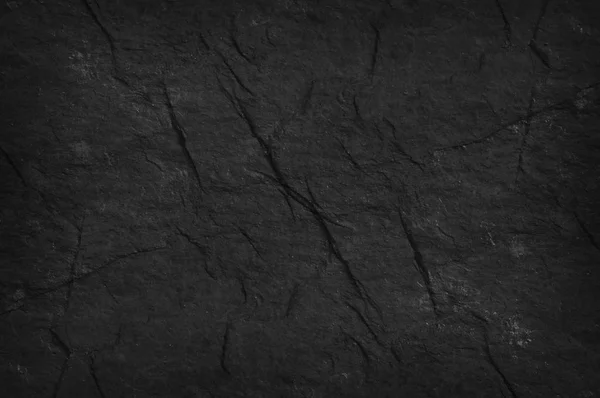 Zwarte stenen oude muur textuur — Stockfoto