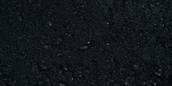 The texture of the black grunge asphalt Banner photo. The seamless texture of bitumen road asphalt. — Stock Photo, Image