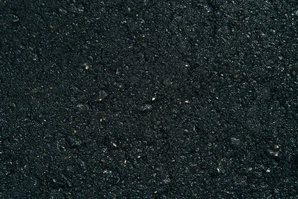 Die Textur des schwarzen Grunge-Asphalts. Die nahtlose Struktur von Asphalt aus Bitumen. — Stockfoto