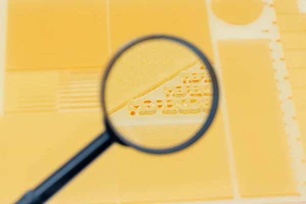 Close Shot Magnifying Glass Showing Detail Test Print Plate Various — Stockfoto