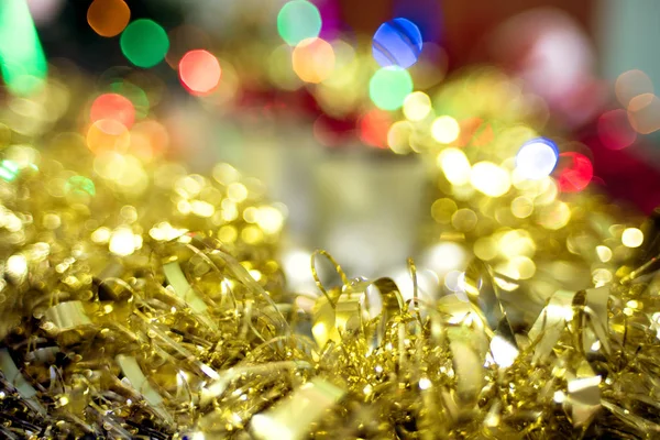 Weihnachten Bokeh Hintergrund von goldenem Lametta — Stockfoto