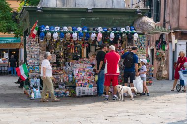 People near souvenir shop in Venice. Italian tourist industry