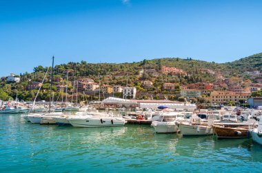 Beautiful Italian town view with yachts moored at the bay