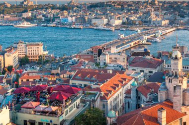 Istanbul cityscape with rooftop bars and restaurants full of peo