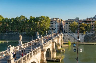 Castle of the Holy Angel bridge with people and Rome historic ce