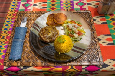 Traditional African cuisine bobotie mince with rice and salad