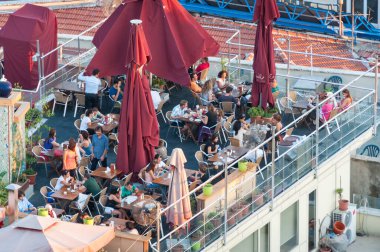 View from above on roof top restaurant with patrons having meals
