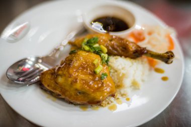 Fried chicken in sticky sauce on rice. Asian cuisine close up