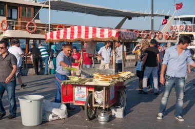 Street food vendor selling grilled corn on streets of Istanbul