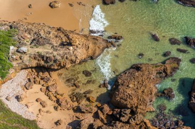 View from above on sheer clifs and beautiful tropical beach