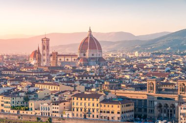 Cathedral of Santa Maria del Fiore and Florence rooftops with mo
