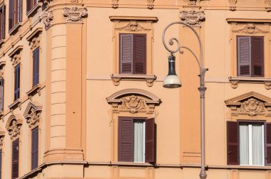 Close up of historic building with decorated window frames
