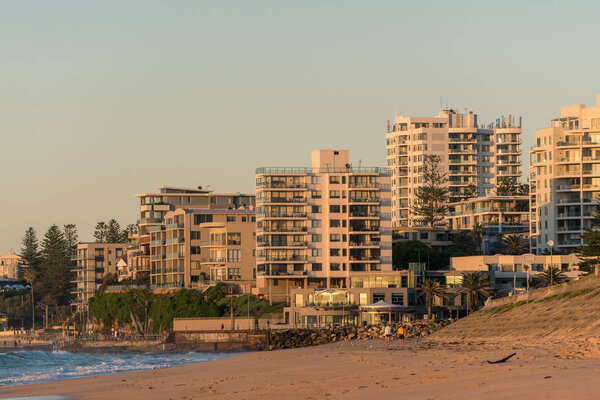 Cronulla beach coastline with waterfront property and people in 