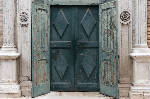 Historic old closed wooden door with peeled off blue paint — 스톡 사진