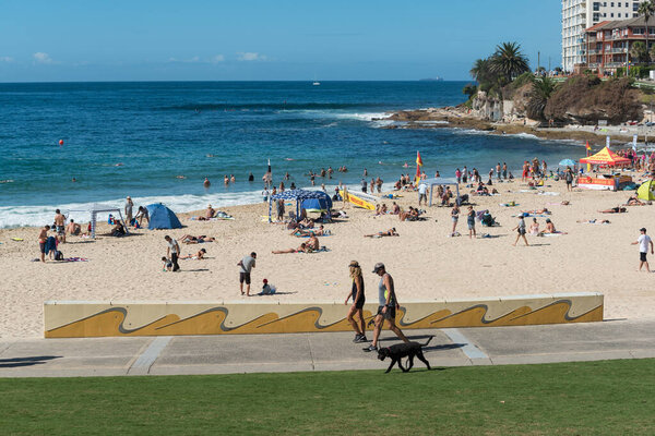 People relaxing on public beach in Cronulla suburb of Sydney
