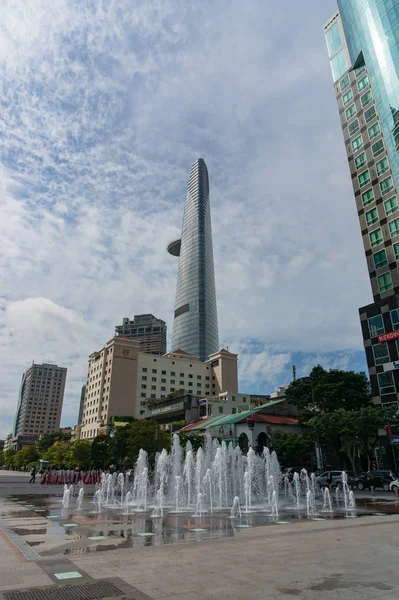 Fountain on Nguyen Hue boulevard with Saigon Skydeck tourist att