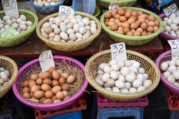 Variety of chicken eggs in a baskets for sale — 스톡 사진