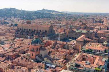 Birds eye view of red rooftops of Bologna, Italy from above.
