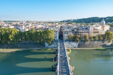 Castle of the Holy Angel bridge with people and Rome historic ce