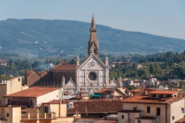 Florence cityscape with rooftops and Franciscan basilica of Santa Croce