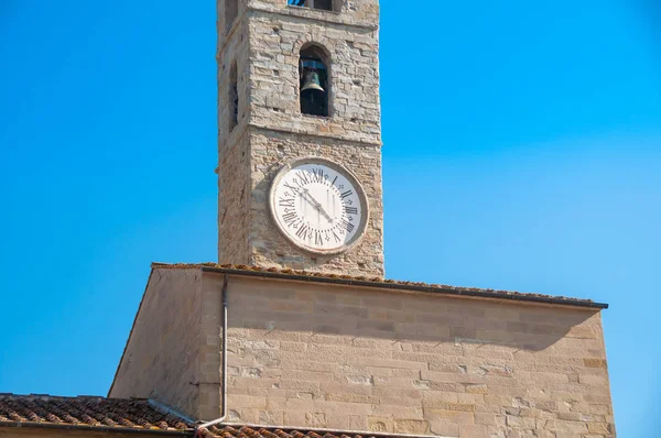 Bell tower with bell and clock with Roman figures — Stok fotoğraf